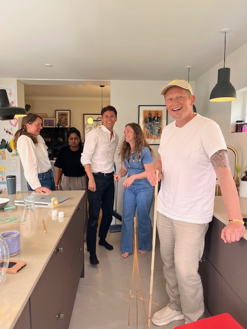 Team gathering in office kitchen